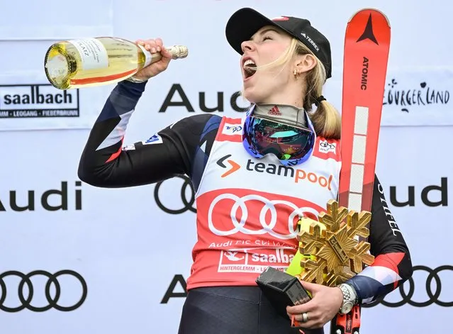 Winner USA's Mikaela Shiffrin celebrates on the podium of the women's Slalom event of FIS Ski Alpine World Cup in Saalbach, Austria on March 16, 2024. (Photo by Joe Klamar/AFP Photo)