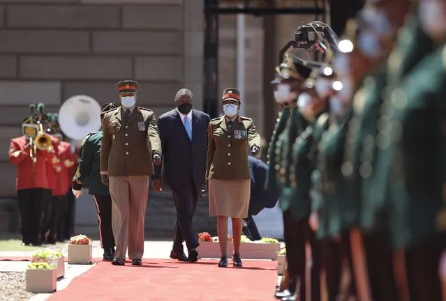 Kenyan President Uhuru Kenyatta, center, reviews the honor guard during his welcoming ceremony in Pretoria, South Africa, Tuesday November 23, 2021. Kenyatta is in South Africa on a state visit to discuss political and economic issues. (Photo by Themba Hadebe/AP Photo)