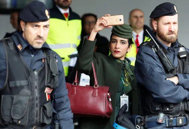 An Alitalia employee takes a picture with her mobile phone as she takes part in a protest at Rome's Fiumicino international airport in Rome, Italy February 23, 2017. (Photo by Remo Casilli/Reuters)