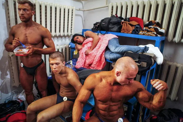 Participants wait backstage during a regional bodybuilding championship in Stavropol, southern Russia, April 10, 2016. (Photo by Eduard Korniyenko/Reuters)