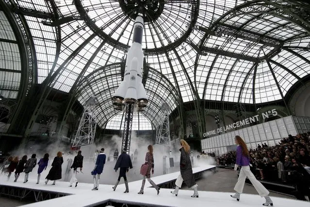 A rocket is launching as models present creations by German designer Karl Lagerfeld as part of his Fall/Winter 2017-2018 women's ready-to-wear collection for fashion house Chanel at the Grand Palais during Fashion Week in Paris, France March 7, 2017. (Photo by Gonzalo Fuentes/Reuters)