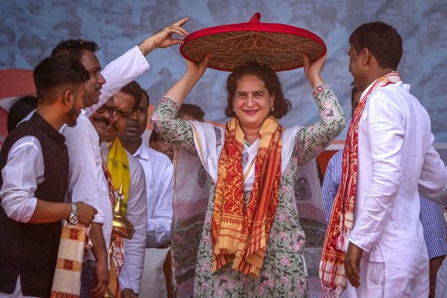 Congress party leader Priyanka Gandhi receives an Assamese Japi during an election rally in Dhubri district in lower Assam, India, Wednesday, May 1, 2024. (Photo by Anupam Nath/AP Photo)