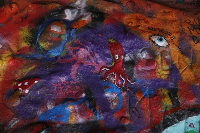 Graffiti is seen inside the Corral Canyon Cave in Malibu, Calif., Friday, May, 6, 2016. Fans of the band who have marked up a scenic cave on the California coast with psychedelic graffiti will have to find another place to spray out their love for front man Jim Morrison. (Photo by Damian Dovarganes/AP Photo)
