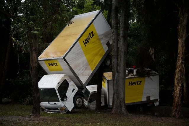Damaged hire trucks after flooding receded in New South Wales, Lismore, Australia on April 3, 2017. Residents have been warned to remain alert for rising flood waters along the swollen Wilsons and Tweed rivers. (Photo by Tracey Nearmy/AAP)