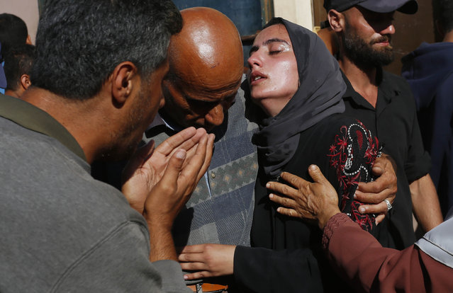 Relatives of the Palestinians who lost their lives after an Israeli attack hits the house belonging to the Al Sous Family at the Bureij refugee camp, mourn after bodies are brought to Al Aqsa Martyrs Hospital in Deir al-Balah, Gaza on May 31, 2024. (Photo by Ashraf Amra/Anadolu via Getty Images)