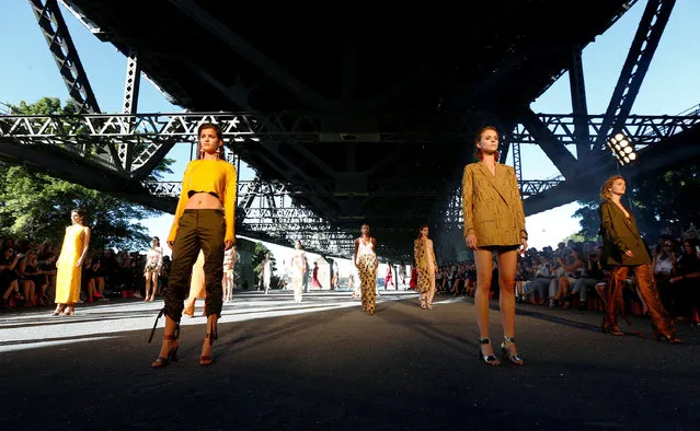 Models stand on stage under the Sydney Harbour Bridge during the Manning Cartel presentation at Australian Fashion week, May 17, 2016. (Photo by Jason Reed/Reuters)