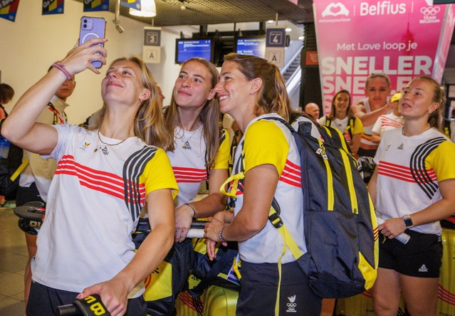 Belgium's female national field hockey team, Red Panthers, players make selfies as they arrive to board a Eurostar train to Paris for the Olympic Games, in Brussels, Belgium, 19 July 2024. The Summer Olympic Games are scheduled to take place from 26 July to 11 August 2024 in Paris. (Photo by Olivier Matthys/EPA/EFE)