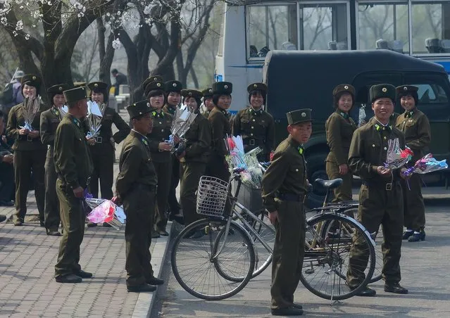These North Korean troops seem unsure whether to smile for the camera or not. (Photo by Gavin John/Mediadrumworld.com)