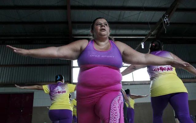 A woman takes part in an aerobics class  in Los Guidos de Desamparados July 23, 2015. (Photo by Juan Carlos Ulate/Reuters)