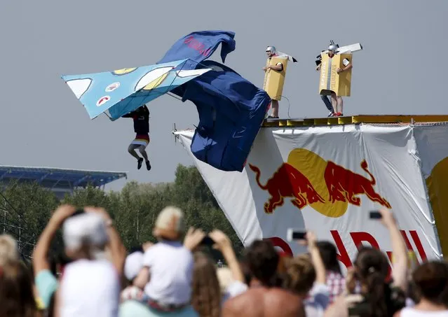 People watch the Red Bull Flugtag Russia 2015 competition in Moscow, Russia, July 26, 2015. (Photo by Sergei Karpukhin/Reuters)