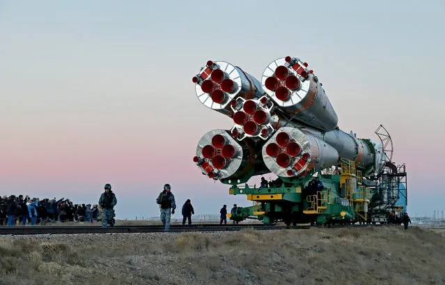 A picture made available on 14 November 2016 shows the Soyuz MS-03 spacecraft transported to the launch pad at the Russian-leased Baikonur cosmodrome in Kazakhstan, 13 November 2016. New International Space Station (ISS) crew members US astronaut Peggy Annette Whitson of NASA, French astronaut Thomas Pesquet of European Space Agency (ESA) and Russian cosmonaut Oleg Novickiy of the Russian space agency Roscosmos are set to take off from Kazakhstan's Baikonur cosmodrome to the International Space Station on 17 November. (Photo by Yuri Kochetkov/EPA)