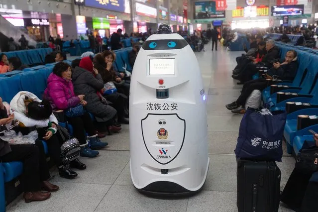 A police robot patrols at Changchun Railway Station on December 2, 2019 in Changchun, Jilin Province of China. The police robot can patrol, monitor and also can recognize passengers' faces to compare with the faces of the escaped criminals. (Photo by VCG/VCG via Getty Images)