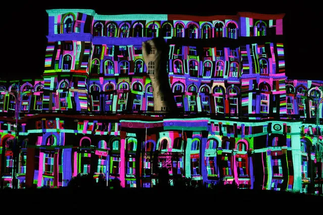 A projection is seen on the facade of Romania's Parliament Palace during a new media art event “iMapp”, a video mapping contest, in Bucharest, Romania, September 18, 2021. (Photo by Xinhua News Agency/Rex Features/Shutterstock)