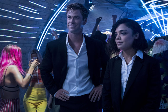 This image released by Sony Pictures shows Chris Hemsworth, left, and Tessa Thompson in a scene from Columbia Pictures' “Men in Black: International”. (Photo by Giles Keyte/Sony/Columbia Pictures via AP Photo)