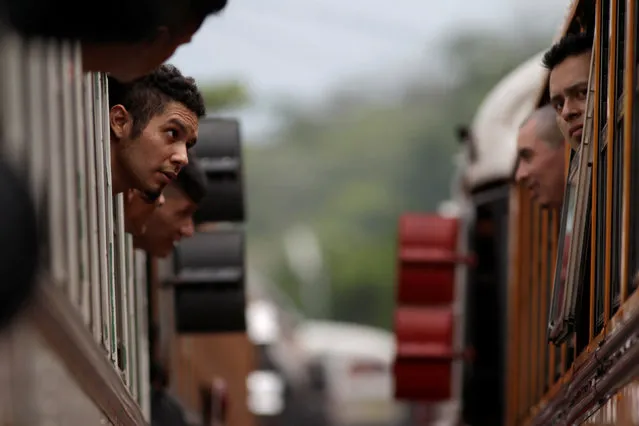Members of the Barrio 18 Gang wait on a bus as 1282 inmates are transferred from the cojutepeque jail  in Cojutepeque, El Salvador June 16, 2016. (Photo by Jose Cabezas/Reuters)