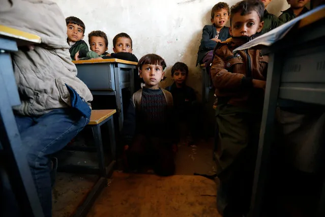 Yemeni children attend class at a school on the outskirts of Sana'a, Yemen, 18 November 2019. The war in Yemen, which has dragged on for nearly five years, has affected over 12 million children, the United Nations says. (Photo by Yahya Arhab/EPA/EFE)