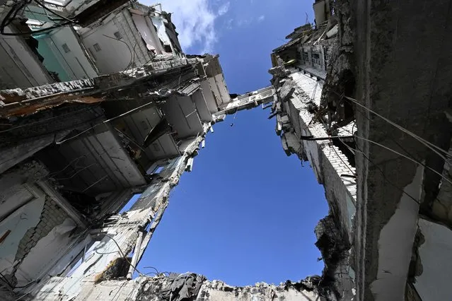 This photograph taken on June 10, 2022, shows the regional government building destroyed by a Russian missile strike in March 2022, in the southern Ukrainian city of Mykolaiv, amid the Russian invasion of Ukraine. (Photo by Genya Savilov/AFP Photo)