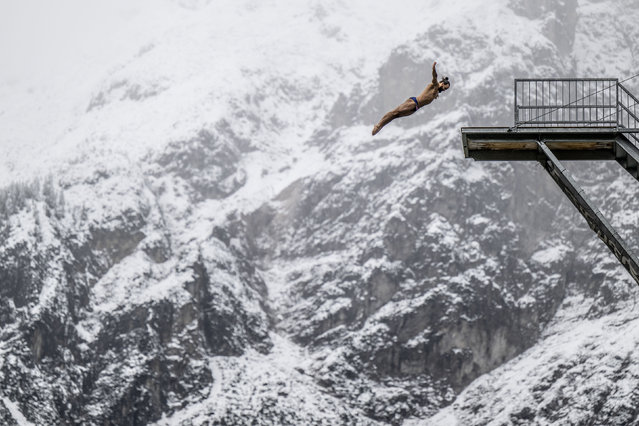 In this handout image provided by Red Bull, Red Bull Cliff Diving athlete, Catalin Preda of Romania, dives from the 27 metre platform during a training session on September 14, 2024 at Area 47 in Tyrol, Austria. (Photo by Dean Treml/Red Bull via Getty Images)