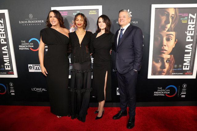 Cast members Karla Sofia Gascon, Zoe Saldana and Selena Gomez pose with CEO of Netflix Ted Sarandos at a screening of the film Emilia Perez on the opening night of the 28th Annual American French Film Festival in Los Angeles, California, U.S., October 29, 2024. (Photo by Mario Anzuoni/Reuters)