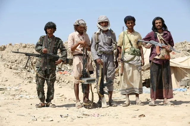 Anti-Houthi militiamen loyal to Yemen's exiled government pose for a photo in their position in the northern province of Marib August 24, 2015. The northern-based Houthis, a Shi'ite Muslim group, took control of Yemen's capital Sanaa last September. Arab countries intervened in the conflict in March to halt a Houthi advance into the south which caused the Saudi-backed government to flee to Riyadh from its refuge in the southern port of Aden. (Photo by Reuters/Stringer)