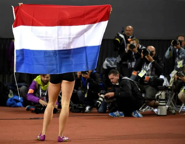 Netherlands' Gold medalist Dafne Schippers poses for photographers after winning the Women's 100m final during the European Athletics Championships at the Letzigrund stadium in Zurich on August 13, 2014. (Photo by Fabrice Coffrini/AFP Photo)