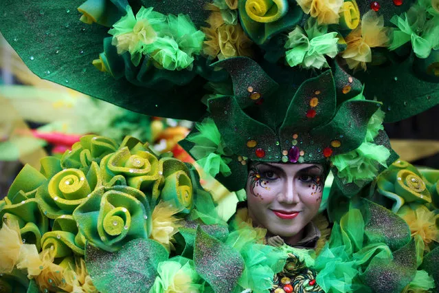 A model showcases a design on the catwalk during the eighth Jember Fashion Carnival on August 2, 2009 in Jember, East Java, Indonesia. (Photo by Ulet Ifansasti/Getty Images)