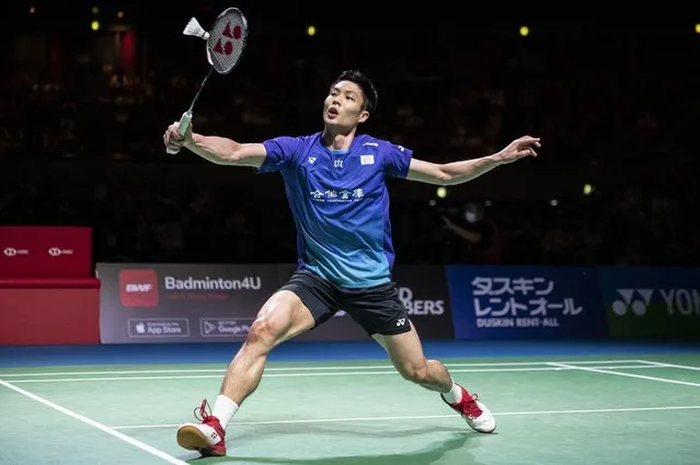 Chou Tien-chen of Taiwan hits a return against Kenta Nishimoto of Japan during the men's singles final on day six of the Japan Open badminton tournament in Osaka on September 4, 2022. (Photo by Yuichi Yamazaki/AFP Photo)