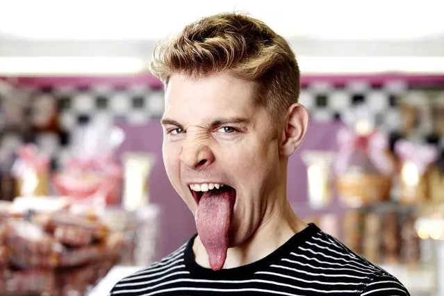 A recent undated handout picture released by the Guinness World Records on September 9, 2014, shows 24-year-old Nick Stoeberl from California, USA, who has secured his place in the 2015 Guinness World Records book for having the longest tongue that measures 10.1cm (3.97in) from its tip to the middle of the closed top lip. (Photo by James Ellerker/AFP Photo/Guinness World Records)