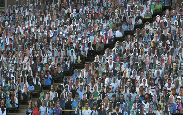 Cardboard cut-outs with portraits of Borussia Moenchegladbach's supporters are seen at the Borussia Park football stadium in Moenchengladbach, western Germany, on May 19, 2020, amid the novel coronavirus COVID-19 pandemic. (Photo by Ina Fassbender/AFP Photo)