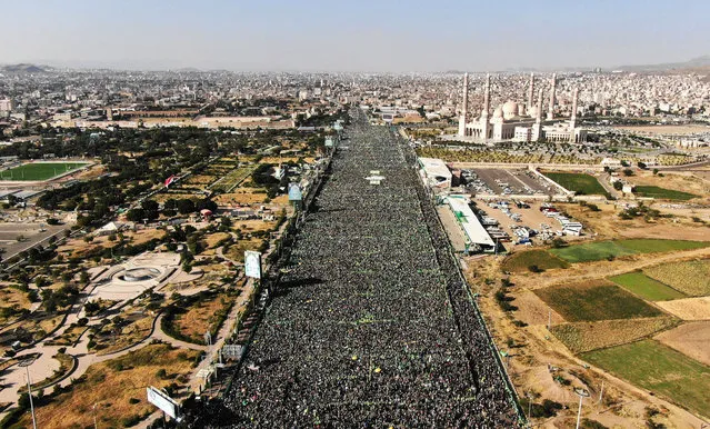 An aerial view of people attending a celebration to commemorate the birthday of the Prophet Muhammad on October 08, 2022, in Sana'a, Yemen. Muslims across the world mark the birthday of the Prophet Muhammad in a celebration known as Mawlid an-Nabi, or mild. (Photo by Mohammed Hamoud/Getty Images)