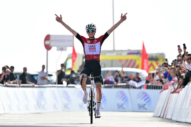 UAE Team Emirates' Slovenian rider Tadej Pogacar celebrates as he crosses the finish line at the end of the seventh stage of the UAE Tour cycling race from Hazza Bin Zayed Stadium to Jebel Hafeet in the United Arab Emirates, on February 23, 2025. (Photo by Giuseppe Cacace/AFP Photo)