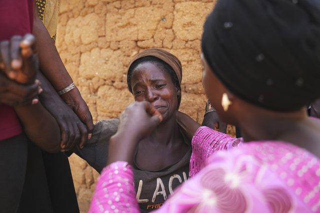 Women mourn the death of a family member following an attack by gunmen in the Zike farming community in north-central Nigeria, April 15, 2025. (Photo by Samson Omale/AP Photo)