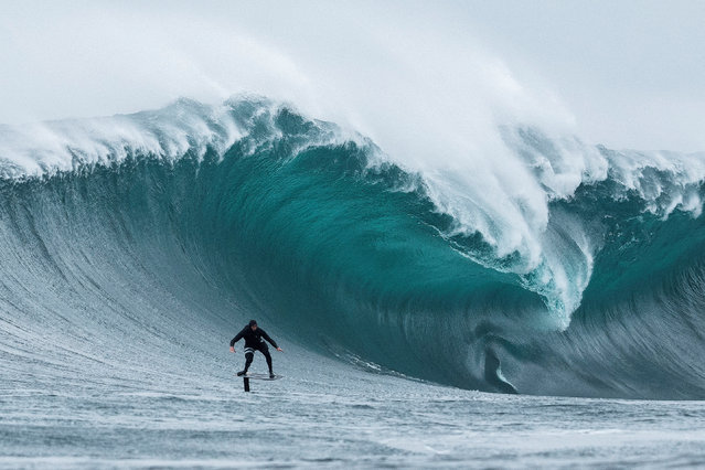 South African big wave surfer Jaques Theron rides a wave at Dungeons offshore reef on a foil board as seasonal cold fronts drive big swells into the Cape Peninsula in Cape Town, South Africa, on June 1, 2025. (Photo by Nic Bothma/Reuters)