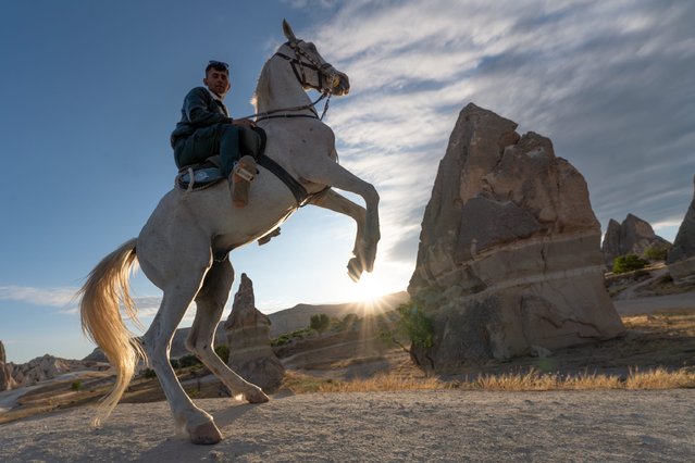 A man rides a horse at Cappadocia, which held a special place for horses throughout history, in Nevsehir, Turkiye on June 29, 2025. Visitors to the region can join guided horseback tours held in the wide valleys, especially during morning and evening hours. Located within the borders of Nevsehir, Cappadocia stands out not only for its natural formations but also for its rich cultural heritage. (Photo by Ayten Altintas/Anadolu via Getty Images)