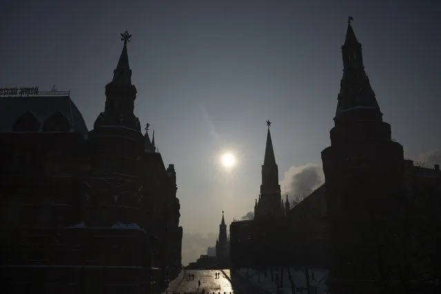 A virtually empty Red Square closed for security reasons prior to Russian President Vladimir Putin's annual state of the nation address, is seen between the Historical Museum, left, and the Kremlin Wall, right, in Moscow, Russia, Tuesday, February 21, 2023. (Photo by Alexander Zemlianichenko/AP Photo)