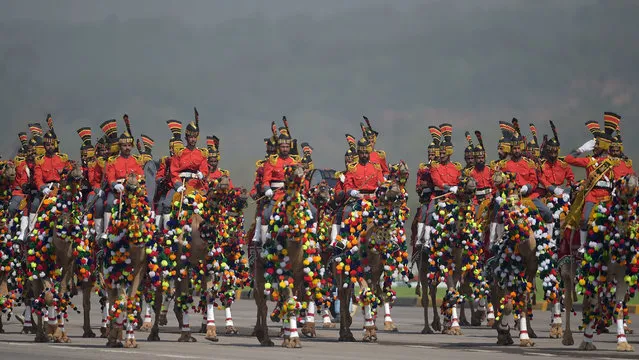 A Pakistani camel-mounted military band performs during a Pakistan Day military parade in Islamabad on March 23, 2018. Pakistan National Day commemorates the passing of the Lahore Resolution, when a separate nation for the Muslims of The British Indian Empire was demanded on March 23, 1940. (Photo by Aamir Qureshi/AFP Photo)
