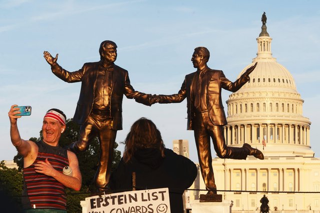 A statue depicting President Donald Trump, left, and Jeffrey Epstein holding hands stands at sundown on the National Mall with the U.S. Capitol in the background, Thursday, October 2, 2025, in Washington. (Photo by Manuel Balce Ceneta/AP Photo)