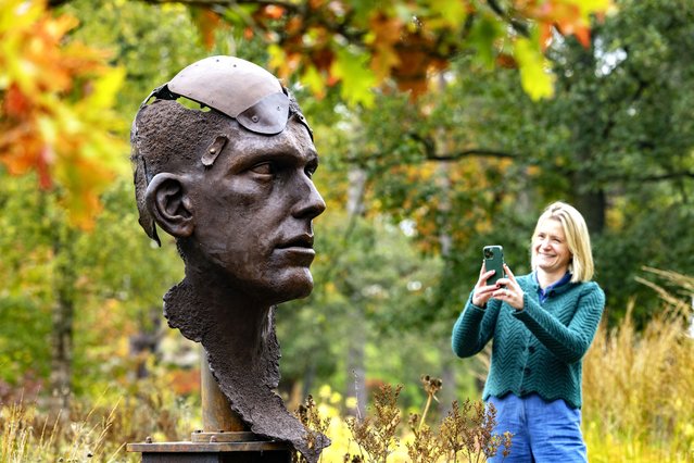 Sophie Roberts admires Angel of the Trench by artists Laura and Paul Carey at the Himalayan Garden and Sculpture Park near Masham, North Yorkshire, UK on October 14, 2025. (Photo by James Glossop/Times Media Ltd)