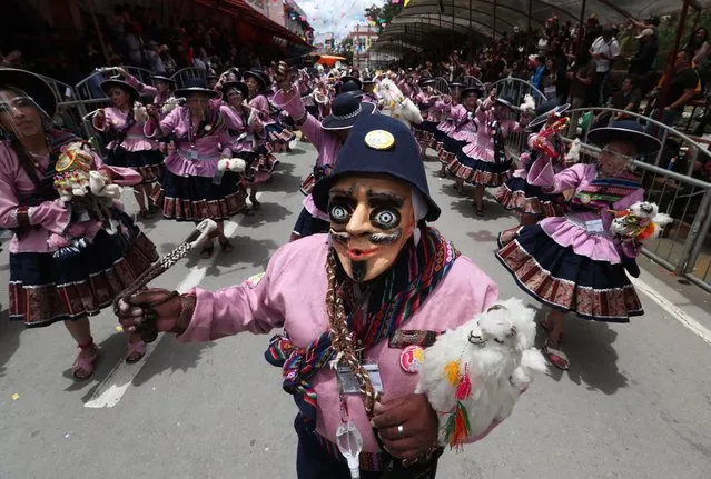 Groups of people perform the dance of the Llamerada, during the beginning of the Carnival in Oruro, Bolivia, 26 February 2022. The Oruro Carnival, the main one in Bolivia, returns after a pause due to the COVID-19 pandemic. (Photo by Martin Alipaz/EPA/EFE)
