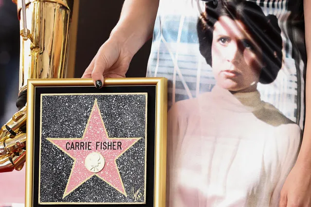A dress featuring actor Carrie Fisher as Star Wars character Princess Leia, is worn by her daughter Billie Lourd as she attends the posthumous unveiling of the star of Carrie Fisher, on the Hollywood Walk of Fame in Los Angeles, California, U.S., May 4, 2023. (Photo by Mario Anzuoni/Reuters)