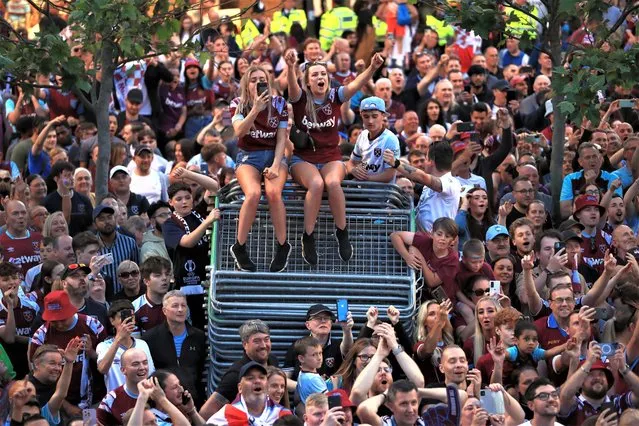 Fans gather to watch West Ham United's open top bus parade through Stratford, London on Thursday, June 8, 2023, following Wednesday's 2-1 victory over Fiorentina in the Europa Conference League final and ended their 43-year wait for a trophy. (Photo by Bradley Collyer/PA Images via Getty Images)