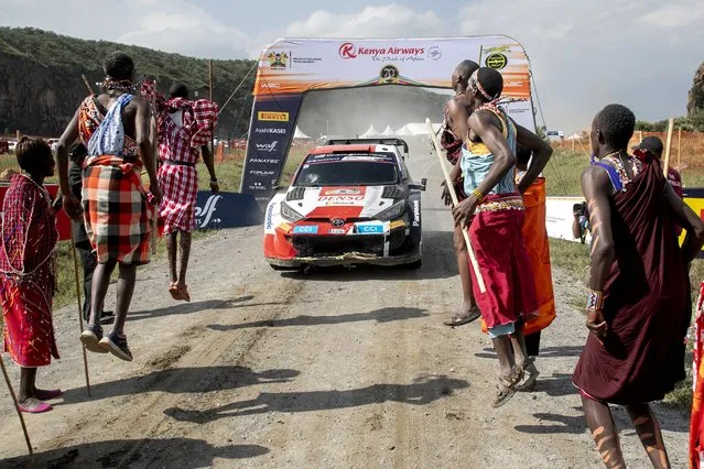 French rally team of driver Sebastian Ogier and his co-driver Vincent Landais arrive to pomp at the finish line to win the WRC Safari Rally Kenya, part of the FIA World Rally Championship in their Toyota Gr Yaris Rally1 Hybrid at the lake-side town of Naivasha on June 25, 2023. (Photo by Tony Karumba/AFP Photo)
