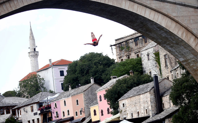 A man jumps from the Old Bridge during the 452nd traditional diving competition in Mostar, Bosnia and Herzegovina, July 29, 2018. (Photo by Dado Ruvic/Reuters)