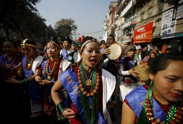 Gurung girls wearing traditional costumes dance while taking part in a New Year parade in Kathmandu, Nepal December 30, 2015. (Photo by Navesh Chitrakar/Reuters)