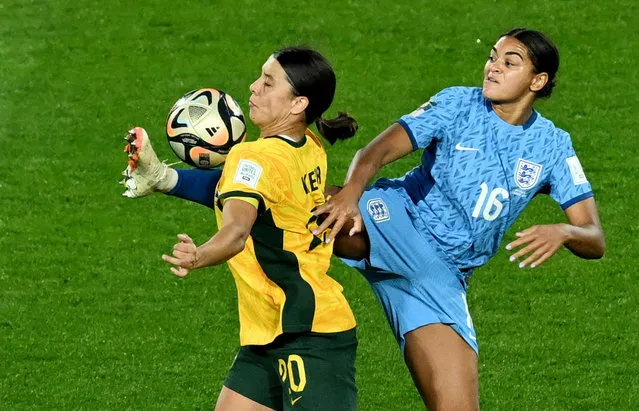 England's Jess Carter and Australia's Sam Kerr battle for the ball in the air during the FIFA Women's World Cup semi-final match at Stadium Australia, Sydney on Wednesday, August 16, 2023. (Photo by Jaimi Joy/Reuters)