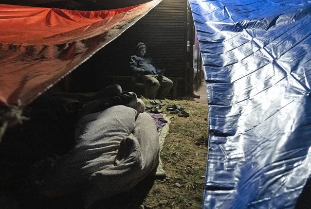 Residents sleep in the open after an earthquake at Jajarkot, about 400 kilometers (250 miles) from Kathmandu, Nepal, Saturday, November 4, 2023. (Photo by Niranjan Shrestha/AP Photo)