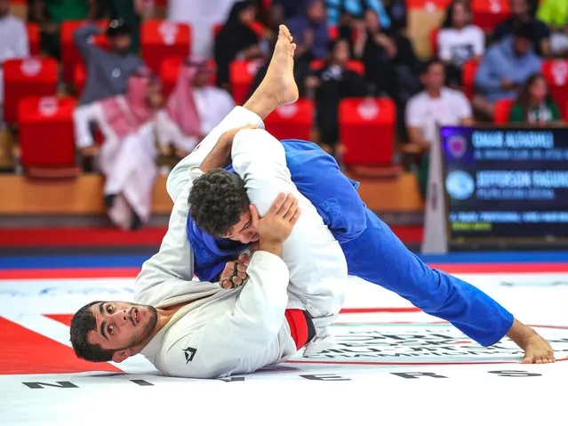 Omar Alfadli of the UAE, white, grapples Jefferson Faguindes for the bronze during the 15th Abu Dhabi World Professional Jiu-Jitsu Championship on November 9, 2023. (Photo by Victor Besa/The National)