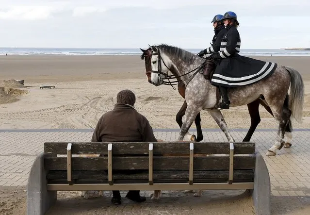 Belgian police officers patrol on horses in the seaside town of Zeebrugge, February 24, 2016, after Belgium set up border checks along its frontier with France to avoid migrants bound for Britain choosing the country as a transit point, as a large camp near the French city of Calais is set to be cleared, Belgium's interior minister said. (Photo by Francois Lenoir/Reuters)