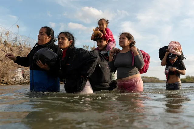 Migrants from Venezuela cross the Rio Grande River from Mexico to Eagle Pass, Texas, U.S., December 20, 2023. (Photo by Cheney Orr/Reuters)