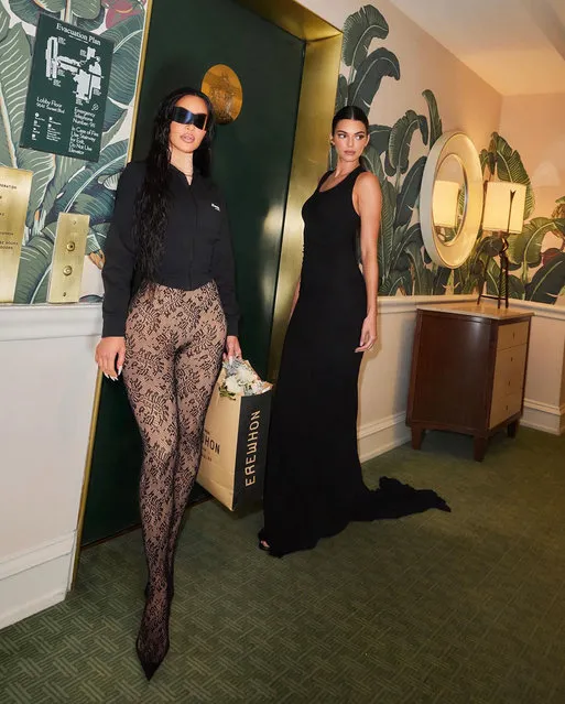 American media personality and socialite Kim Kardashian (left) and American model Kendall Jenner sport a Balenciaga-branded shopping bag from the uber-high-end grocery store Erewhon in LA in the second decade of December 2023. (Photo by Kim Kardashian/Instagram)